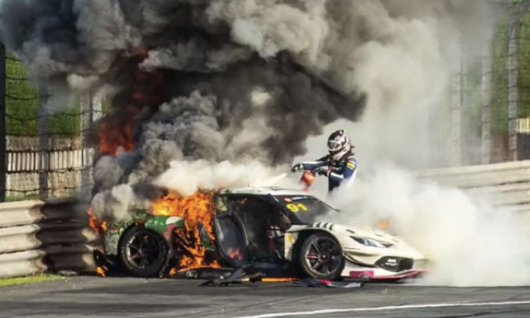 Racing driver stops to rescue rival from burning Ferrari
